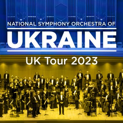 National Symphony Orchestra of Ukraine - UK 2023 tour. Picture of the full orchestra on a concert platform.